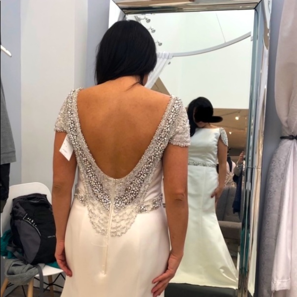 Brand new with tags wedding dress. Never worn. Wedding cancelled due to covid.